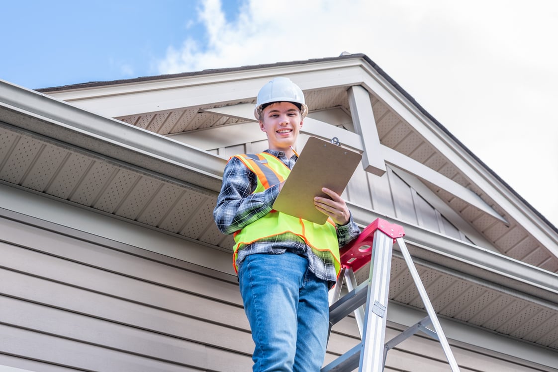 Home inspector providing an inspection to a house.